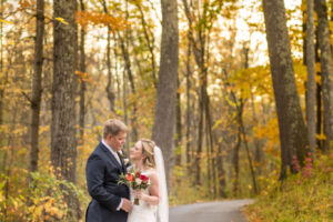 The newlyweds stroll through the enchanting forest The couple celebrating their wedding take a romantic walk amidst the trees