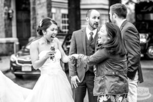 The couple at the wedding is filled with laughter and joy. The wedding couple can't stop laughing with happiness.