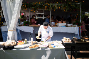 Mazzone Chef preparing dishes for a catered event